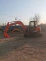 2023 Doosan DH55 mini excavator, side profile view