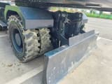 2022 Hyundai 210 wheel excavator dozer blade and wheel detail