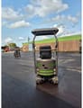 2026 WCM CTX8010 Mini Excavator from the rear, highlighting its black body and green stripe details.