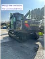 2026 Zoomlion ZE135G Crawler Excavator with a black body, bright green boom, and visible counterweight with model markings.