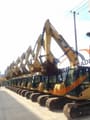 2016 Caterpillar 306D excavator, side profile view of a row of machines