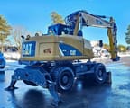 2012 Caterpillar M313D wheel excavator rear three-quarter view