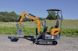 2025 APS KME10 Mini Excavator with its orange boom and arm extended, featuring a standard digging bucket.