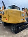 2023 Caterpillar 307E2 crawler excavator, rear three-quarter view