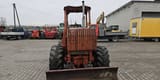 1995 Ditch Witch 7610DD wheel excavator, rear view with blade