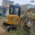 2021 Caterpillar 303.5E mini excavator, rear three-quarter view