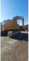 2020 Caterpillar 325 crawler excavator, rear three-quarter view