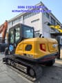 2025 XCMG XE75GA Crawler Excavator showing the right side of the cab and engine compartment with visible vents.
