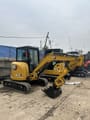 2023 Caterpillar 303.5E mini excavator, front three-quarter view