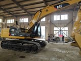 Caterpillar 325DL crawler excavator, side view