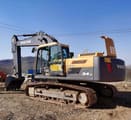 Volvo EC240LC crawler excavator, rear three-quarter view