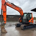 2022 Doosan DX140 crawler excavator, side profile view