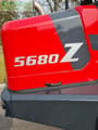 2021 Schäffer 5680Z Mini Excavator showing a close-up of the engine cover with model decals.