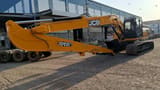 2025 JCB 245LR Crawler Excavator with its long reach boom and arm positioned to the side, revealing the operator's cab.