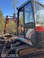 1999 Kubota KX91-2 mini excavator, side view of cab and boom