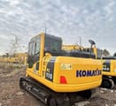 Komatsu PC110 crawler excavator, rear three-quarter view