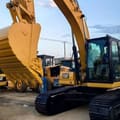 2021 Caterpillar 320 crawler excavator, side view of cab and bucket