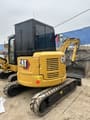 2024 Caterpillar 303.5ECR mini excavator, rear three-quarter view