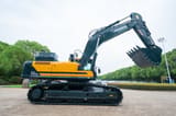 2026 Hyundai HX505L Crawler Excavator showing the dark grey boom and arm with the Hyundai logo clearly visible.