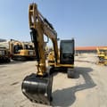 2023 Caterpillar 305.5E2 mini excavator, front view
