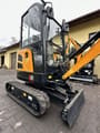 2024 Yuchai U20 Mini Excavator showing a close-up of the operator's cab and the dozer blade.