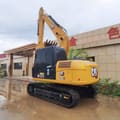 2023 Caterpillar 313D2 GC crawler excavator, rear three-quarter view
