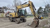 2010 Caterpillar M318D wheel excavator, side profile view