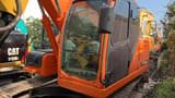 2023 Doosan DX140LC crawler excavator, side view of the cab