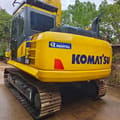 2024 Komatsu PC130 crawler excavator, rear three-quarter view