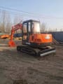 2023 Doosan DH55 mini excavator, rear three-quarter view
