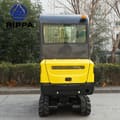 Rear view of the 2026 Rippa R330 Mini Excavator, showing the yellow counterweight and the rear window of the black cab.