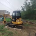 2021 Caterpillar 303.5E mini excavator, rear three-quarter view