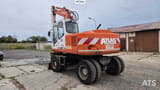 1995 Atlas 1404 wheel excavator, rear three-quarter view