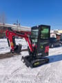 2025 Captok CK13 mini excavator from a front three-quarter view, showcasing the dozer blade in the down position.