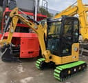 2024 Caterpillar 302CR mini excavator, front three-quarter view