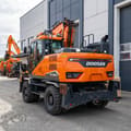 2022 Doosan DX160W-7 wheel excavator, rear three-quarter view