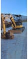 2018 Caterpillar 305.5E2 crawler excavator, front three-quarter view