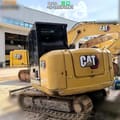2022 Caterpillar 305.5E2 mini excavator, rear three-quarter view