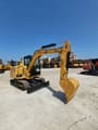 2022 Caterpillar 305.5 mini excavator, front three-quarter view