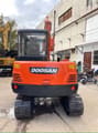 2023 Doosan DX55-9C mini excavator, rear view