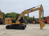 2023 Caterpillar 320GC crawler excavator side view