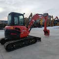 2022 Kubota U55-4 mini excavator, rear three-quarter view