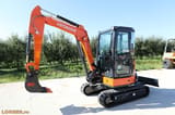 2025 Hitachi ZX33U-5A Mini Excavator showing the orange boom and arm with the Hitachi logo.