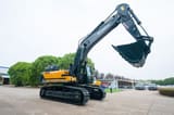 2026 Hyundai HX505L Crawler Excavator with its dark grey boom and arm extended high, showcasing the large digging bucket.