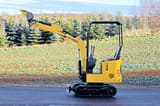 2025 APS KME08 Mini Excavator with its boom raised and a standard digging bucket.