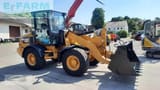 2017 Caterpillar 908M wheel loader, front three-quarter view