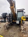 2017 Caterpillar 325FL crawler excavator front view with drilling attachment