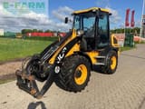 2015 JCB 409 wheel loader, front three-quarter view