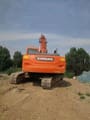 2022 Doosan DX225LC crawler excavator, rear view