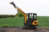 2025 APS KME20 Mini Excavator with its boom raised high and the bucket positioned upwards.
